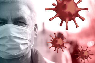 Image of Senior man wearing medical mask outdoors during coronavirus outbreak