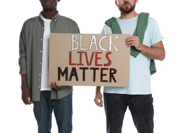 Photo of Men holding sign with phrase Black Lives Matter on white background, closeup. Racism concept