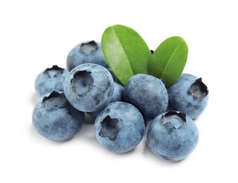 Delicious fresh ripe blueberries with leaves isolated on white