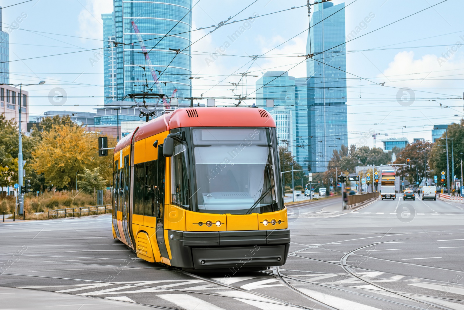 Photo of Modern tram on city street. Public transport