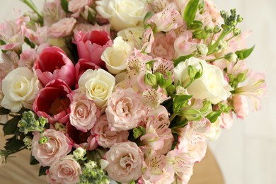 Photo of Beautiful bouquet of fresh flowers in vase on table, closeup