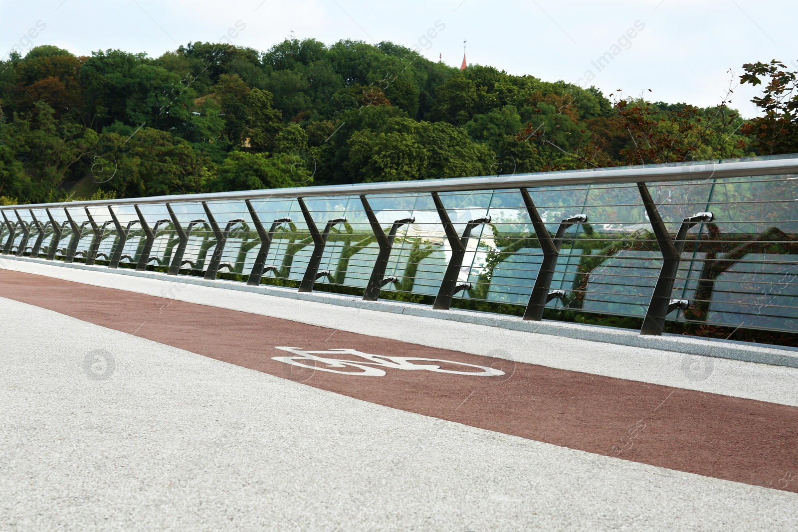 Photo of Modern bridge with bike lane over river