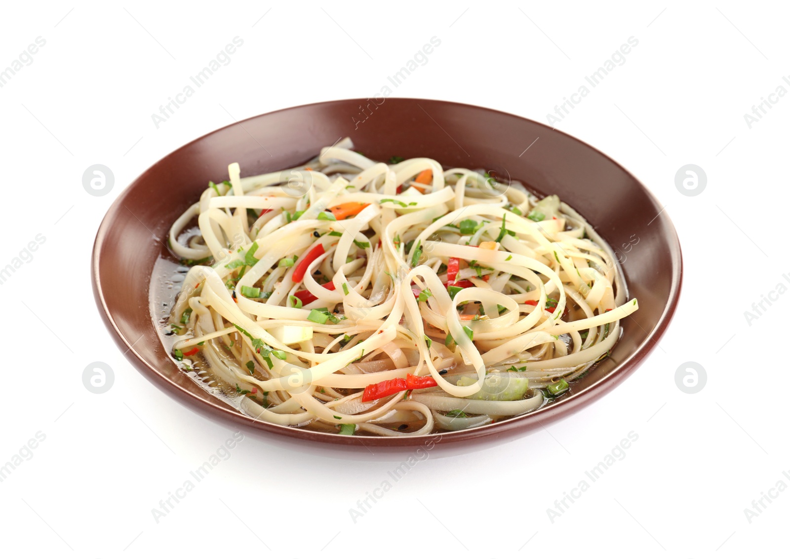 Photo of Plate of delicious noodles with broth and vegetables isolated on white