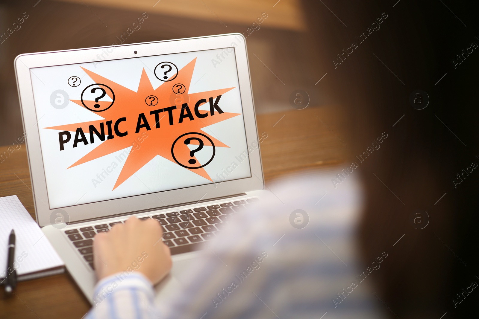 Image of Woman working with laptop. Use information safely to avoid panic attack