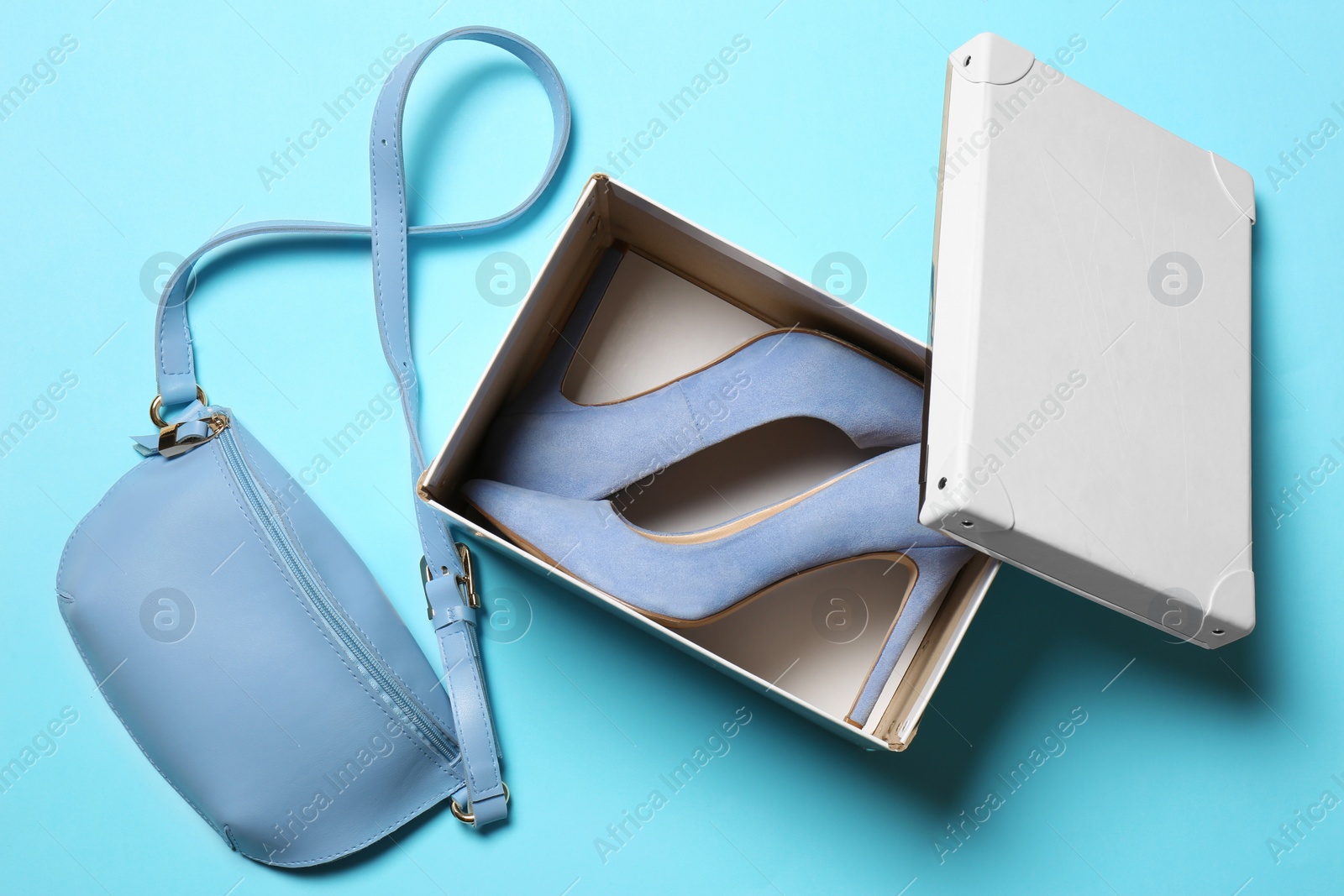 Photo of Flat lay composition with lady's shoes and bag on color background