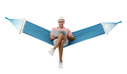 Photo of Man with laptop in hammock on white background