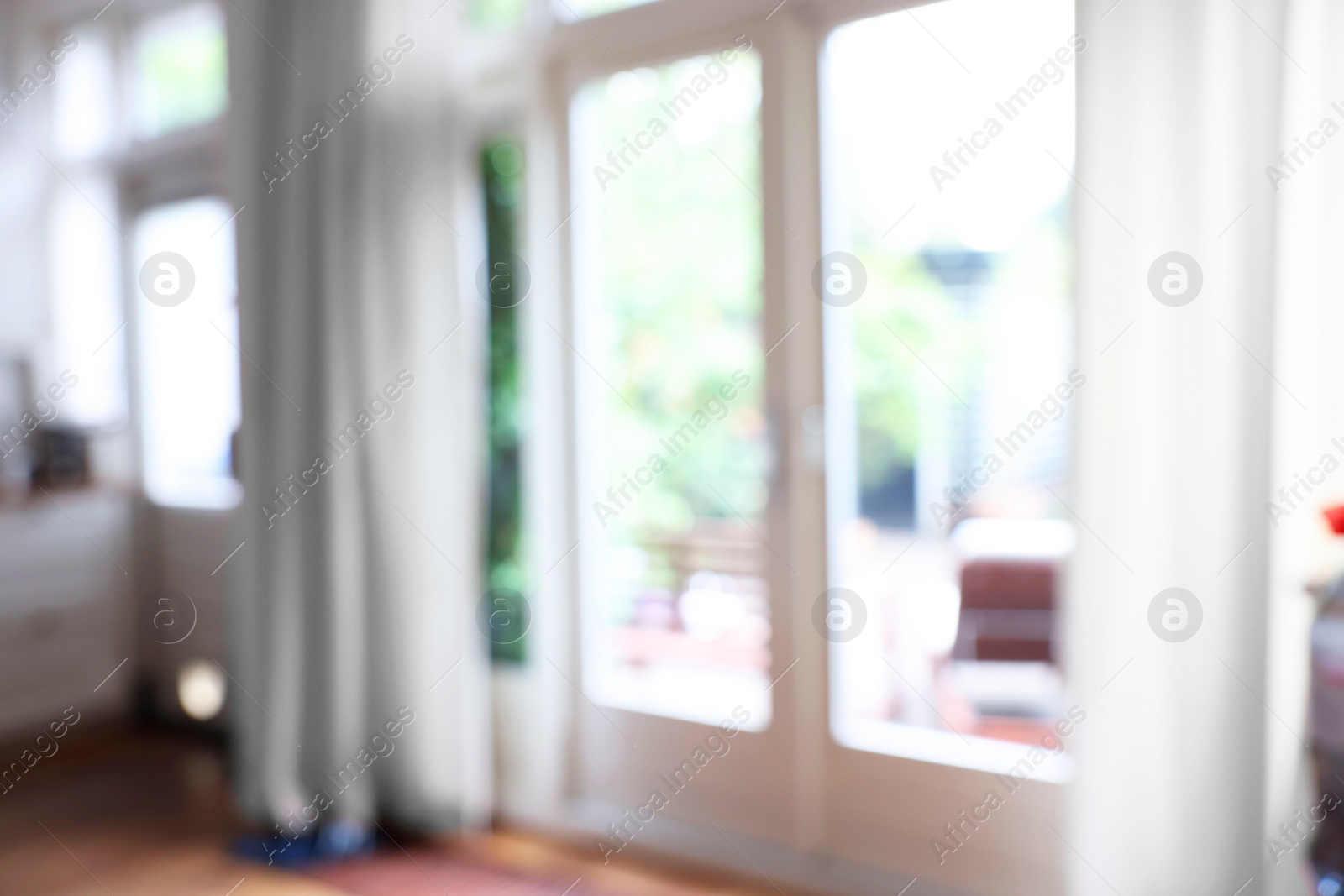 Photo of Blurred view of glass door at home