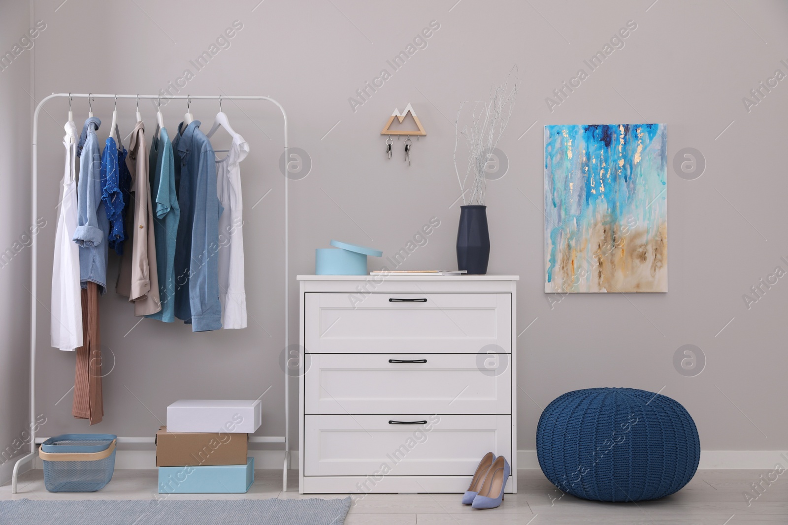 Photo of Modern hallway interior with stylish furniture and key holder