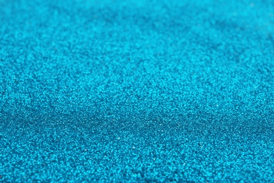 Closeup view of sparkling blue glitter background