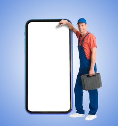 Image of Repair service - just call. Happy professional repairman holding toolbox and smartphone with blank screen on light blue background, space for design