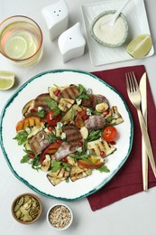 Delicious salad with beef tongue, grilled vegetables, peach and blue cheese on white table, flat lay