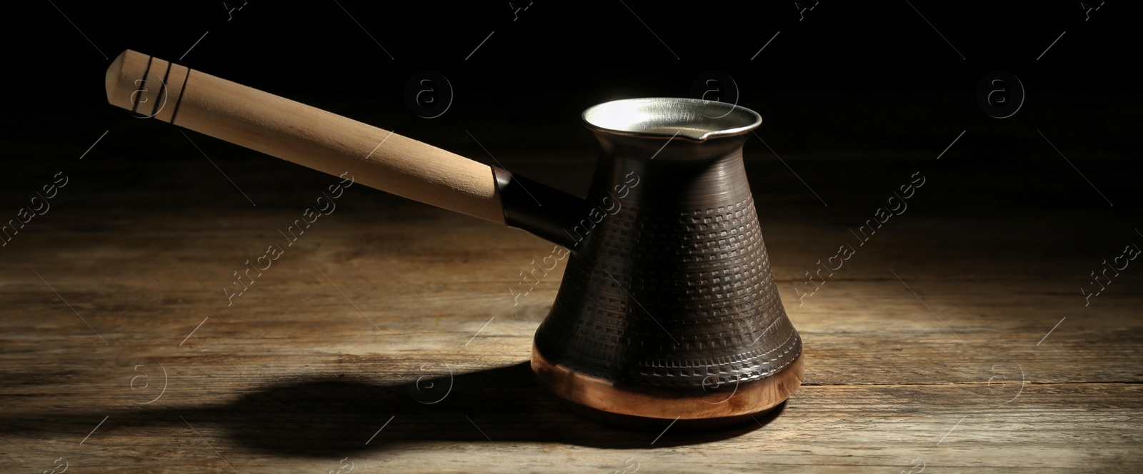 Image of Turkish coffee. Cezve on wooden table. Banner design