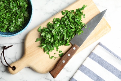 Photo of Flat lay composition with fresh green parsley on marble background