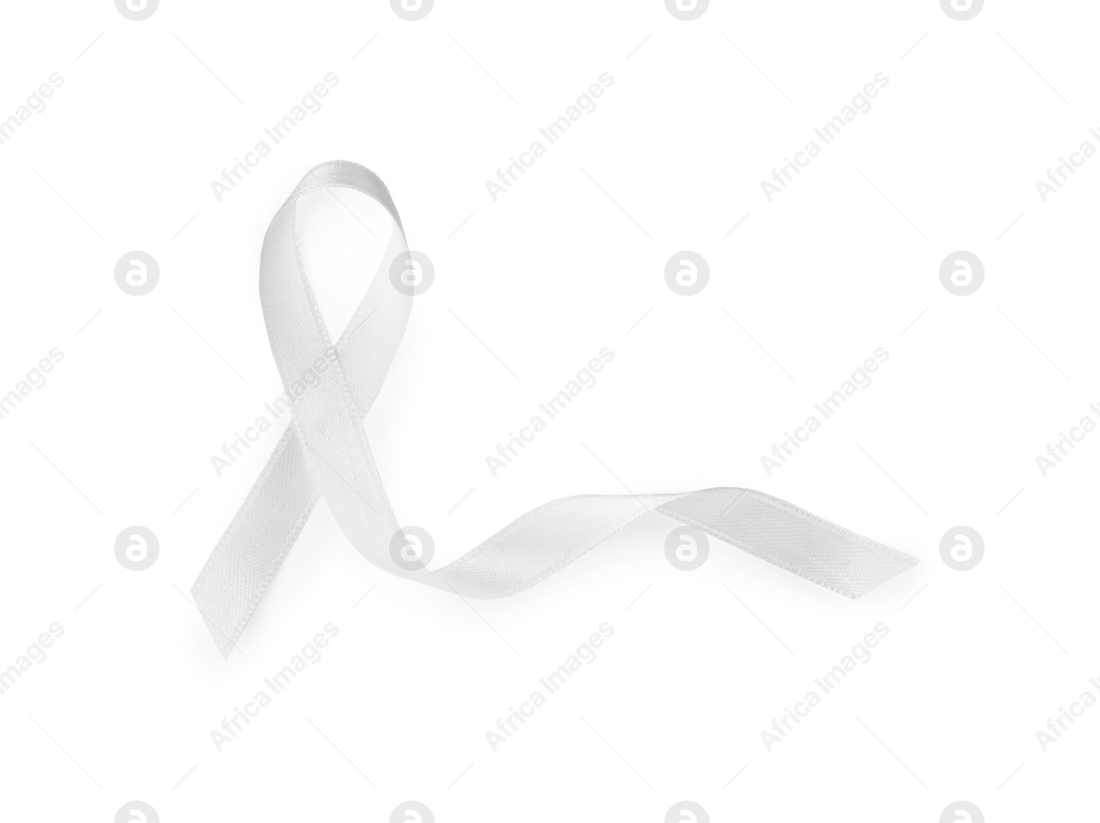 Photo of Satin ribbon on white background, top view