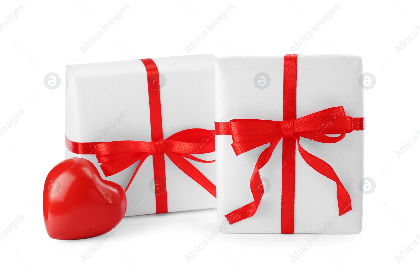 Photo of Beautiful gift boxes with decorative red heart isolated on white