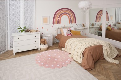 Stylish room with comfortable bed for kids. Interior design