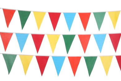 Photo of Buntings with colorful triangular flags on white background. Festive decor