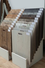 Photo of Many different samples of wooden flooring in store