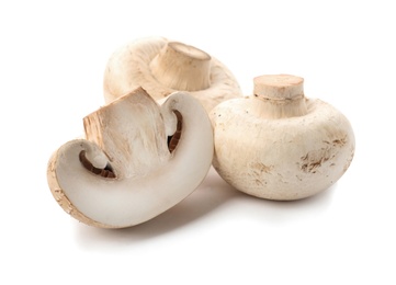 Photo of Fresh raw champignon mushrooms on white background