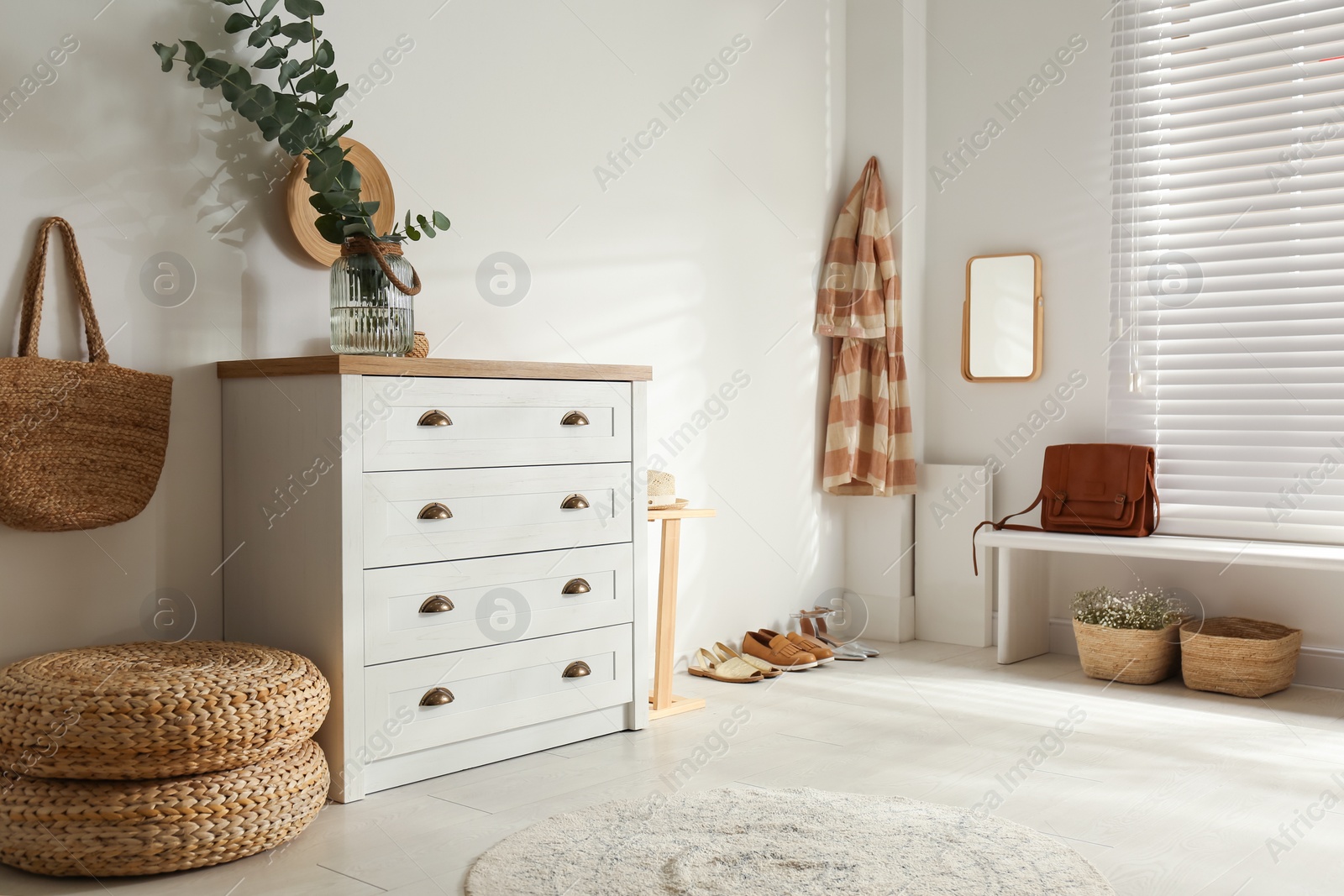 Photo of Chest of drawers in stylish room interior