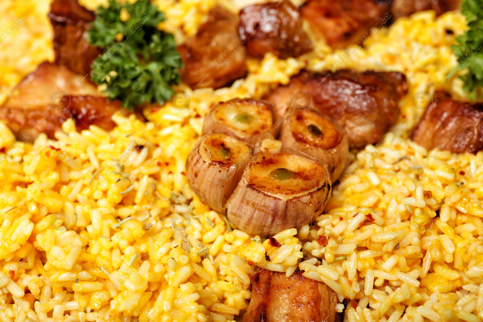 Photo of Delicious rice pilaf with meat as background, closeup