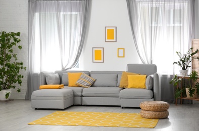 Photo of Living room with comfortable sofa and stylish decor. Idea for interior design