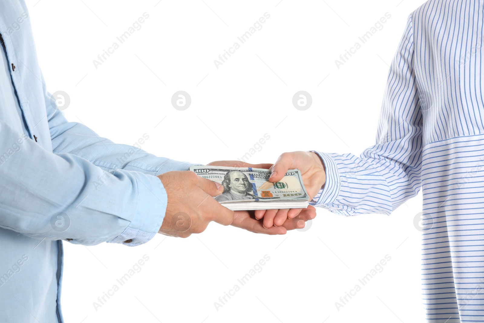 Photo of Man giving bribe money to woman on white background, closeup of hands