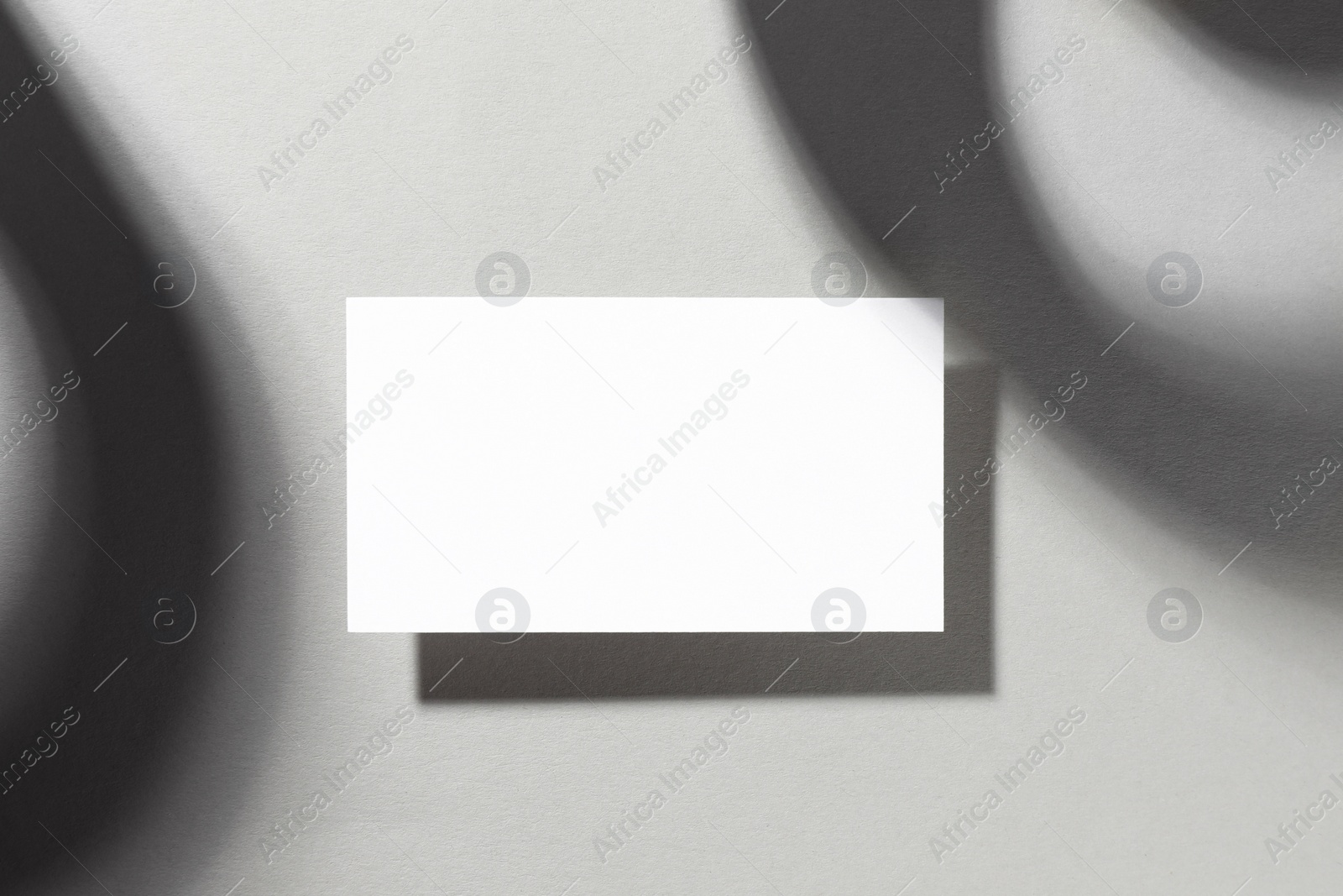 Photo of Empty business card on white background, top view. Mockup for design