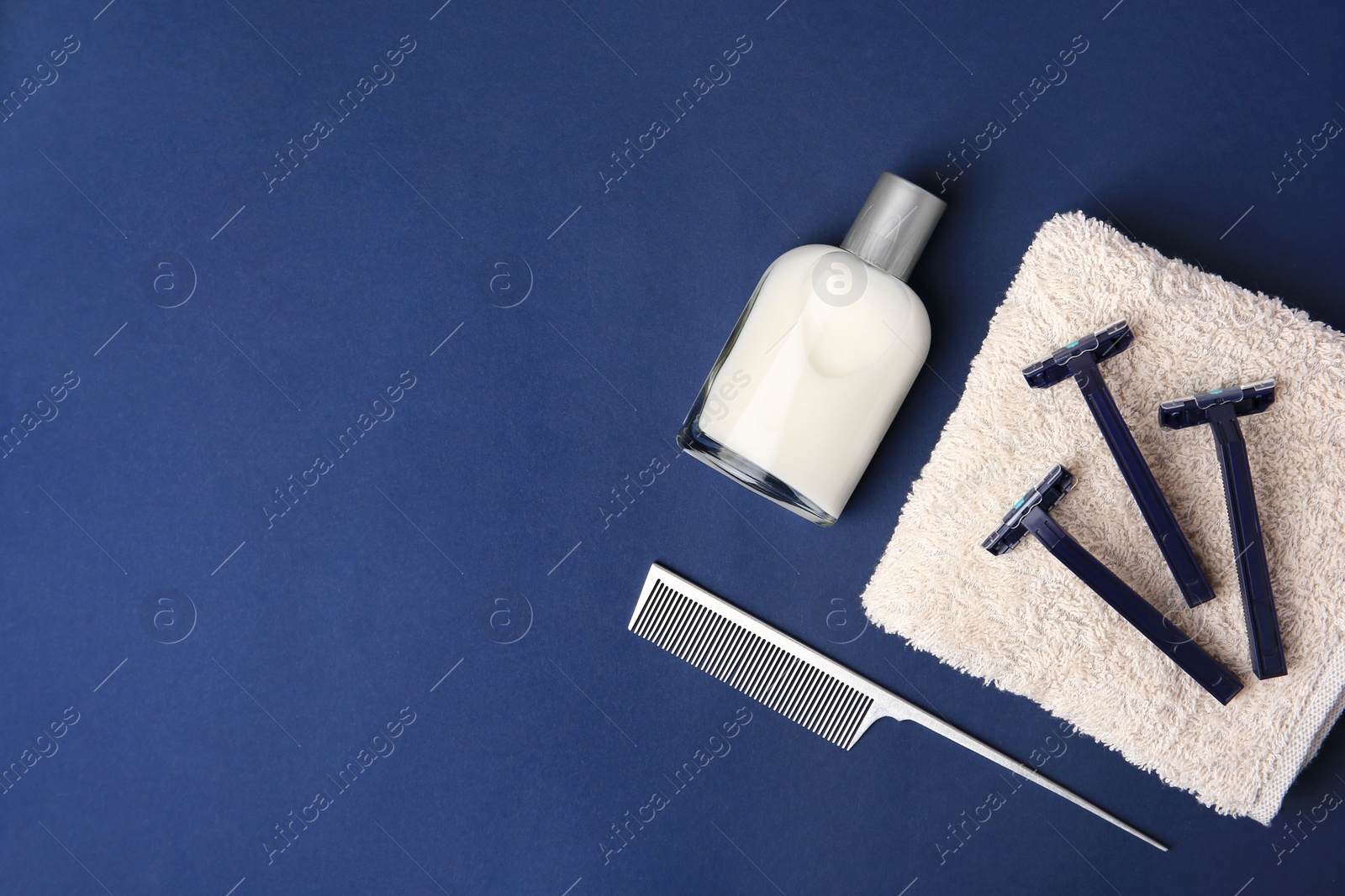 Photo of Flat lay composition with shaving accessories for men on blue background. Space for text