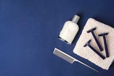 Flat lay composition with shaving accessories for men on blue background. Space for text