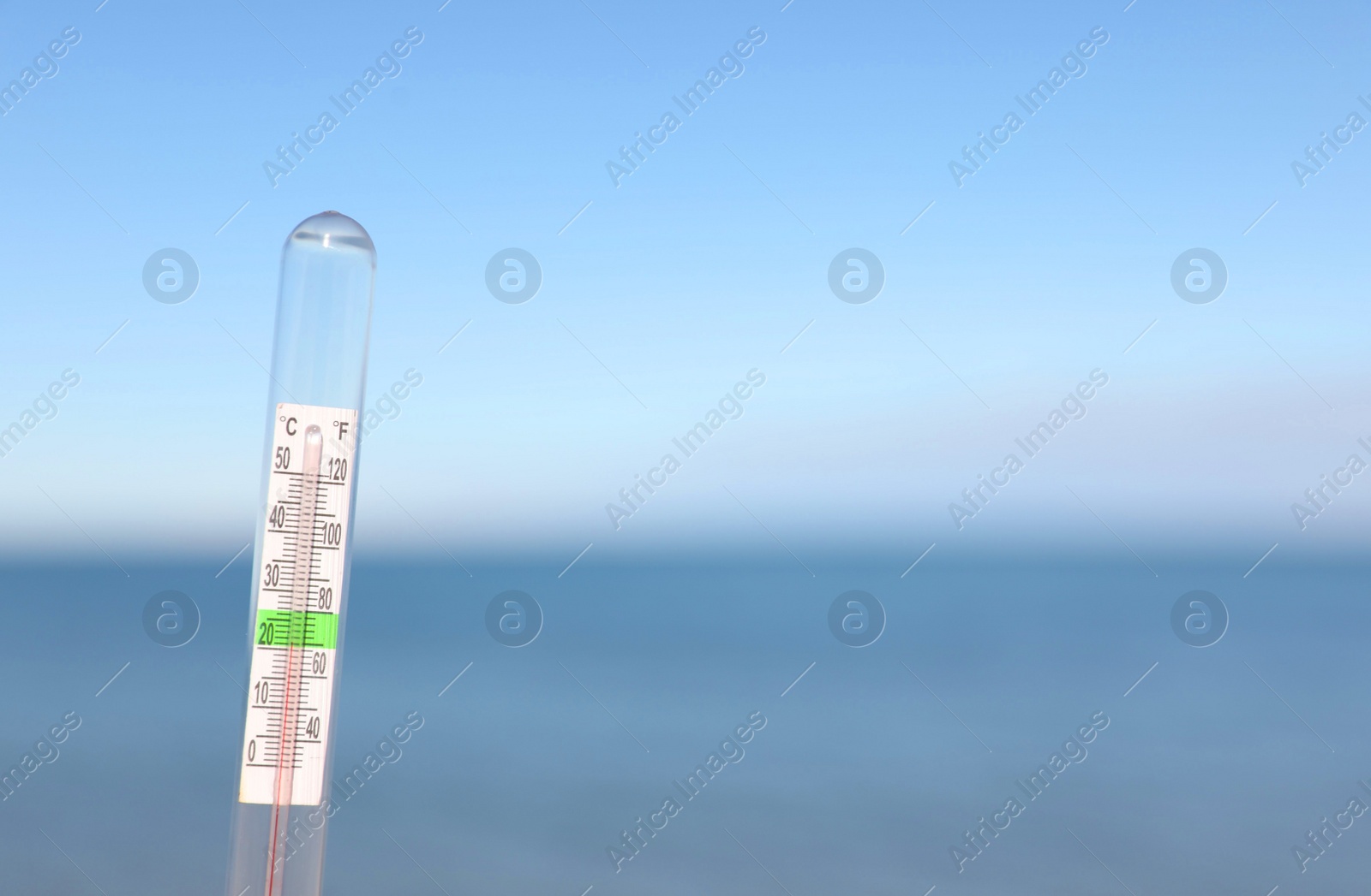 Photo of Weather thermometer at seaside, space for text