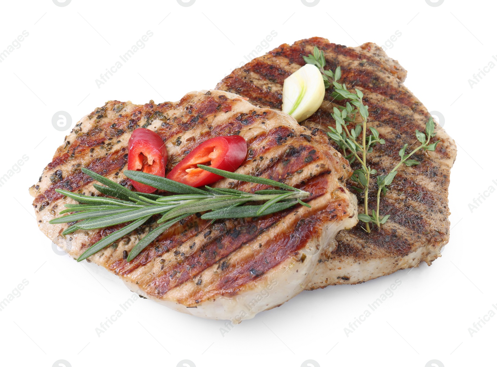 Photo of Delicious grilled pork steaks and spices on white background