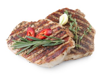 Photo of Delicious grilled pork steaks and spices on white background