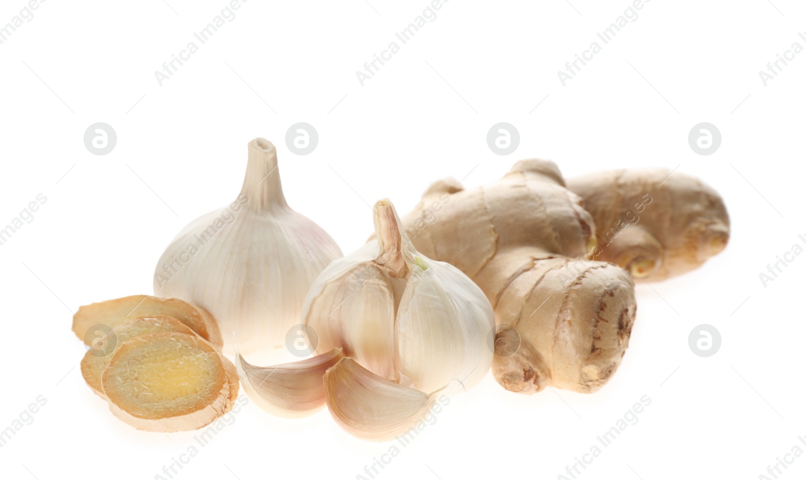 Photo of Ginger and fresh garlic on white background. Natural cold remedies