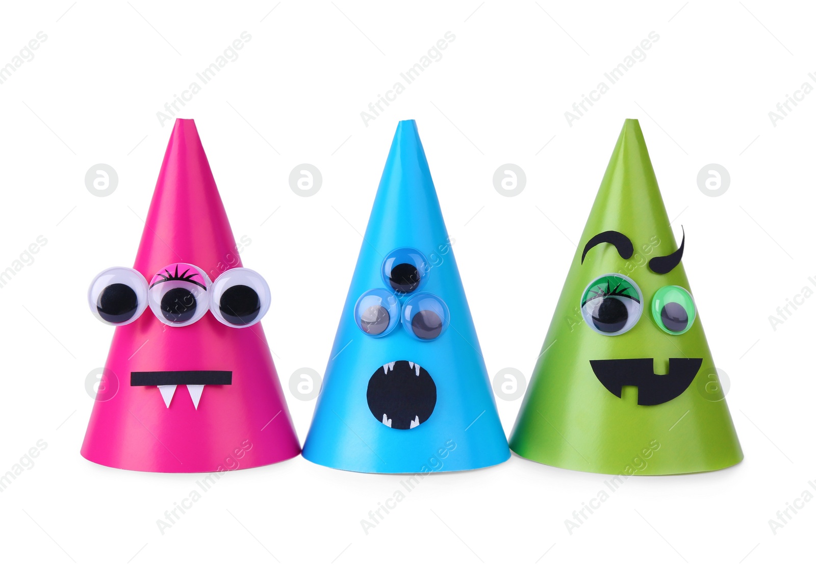 Photo of Funny handmade monsters isolated on white. Halloween decoration