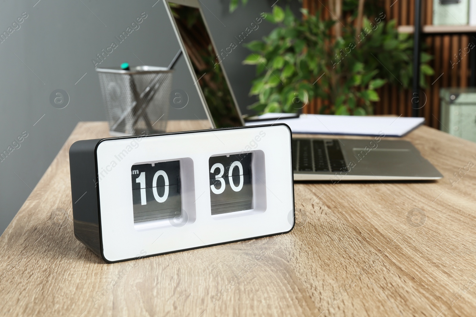 Photo of Stylish flip clock on table in office,  space for text. Time management