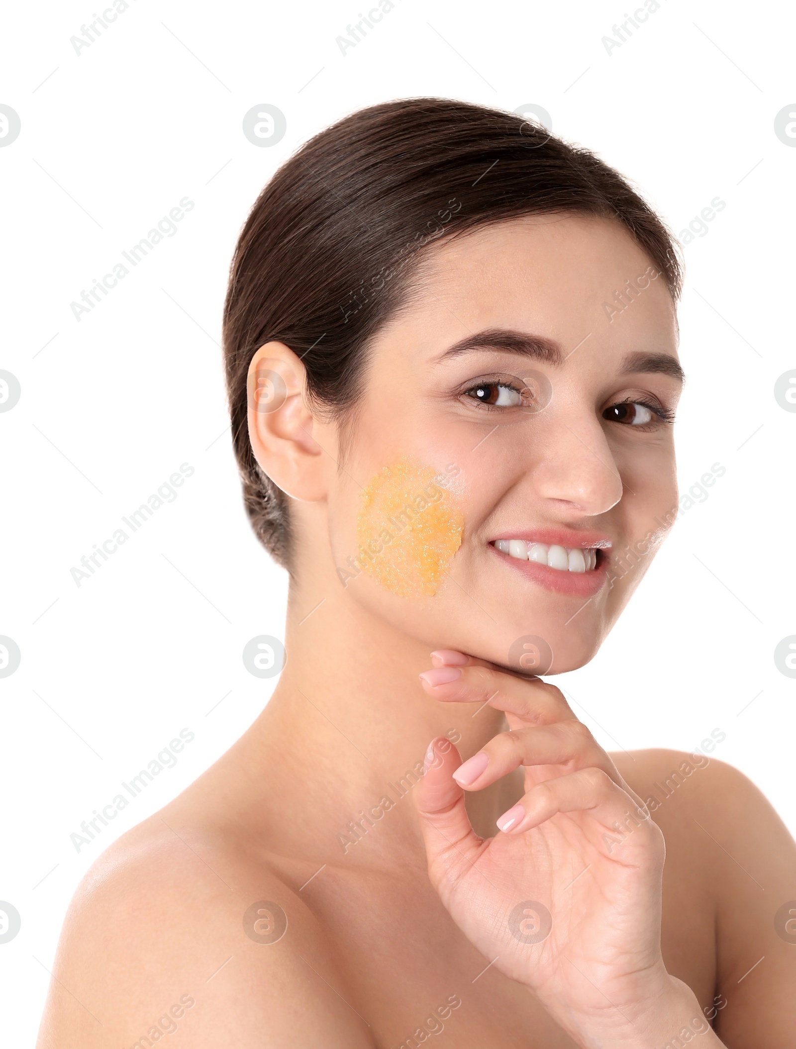 Photo of Young woman with natural scrub on her face against white background