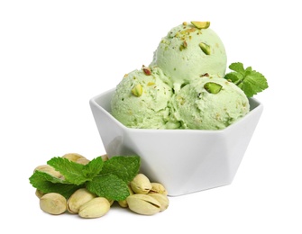 Bowl of delicious pistachio ice cream with mint on white background