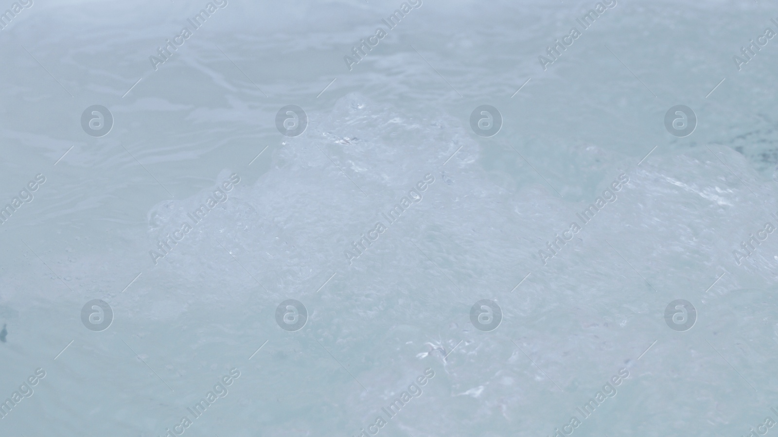 Photo of Water bubbling in hot tub, closeup view