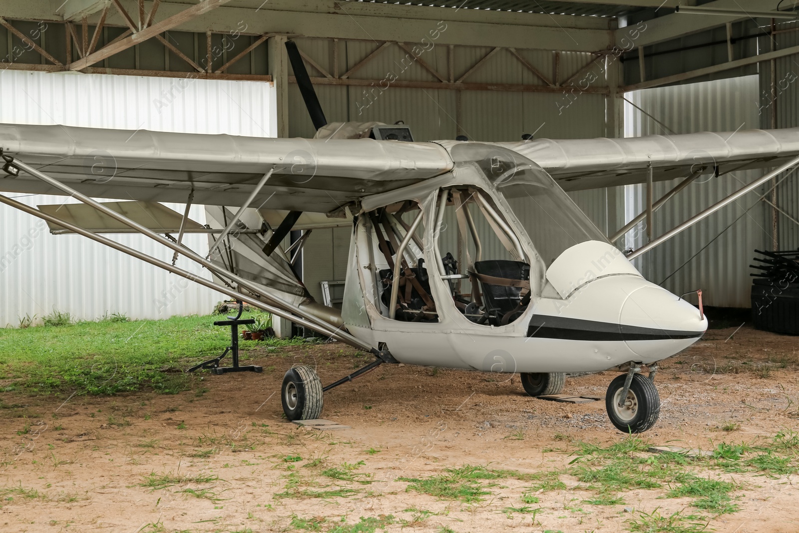 Photo of View of beautiful ultralight airplane in hangar