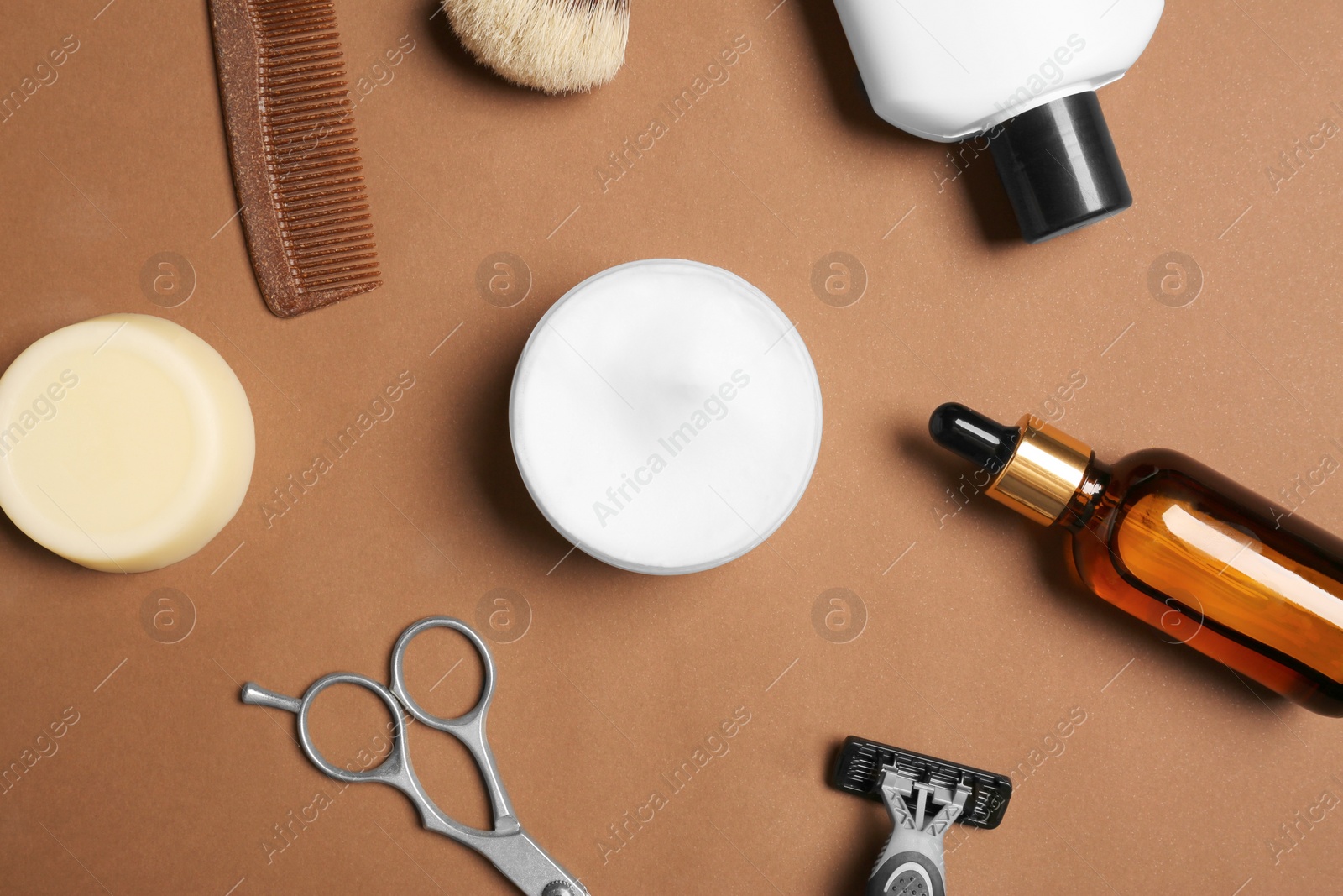 Photo of Set of men's shaving tools on brown background, flat lay