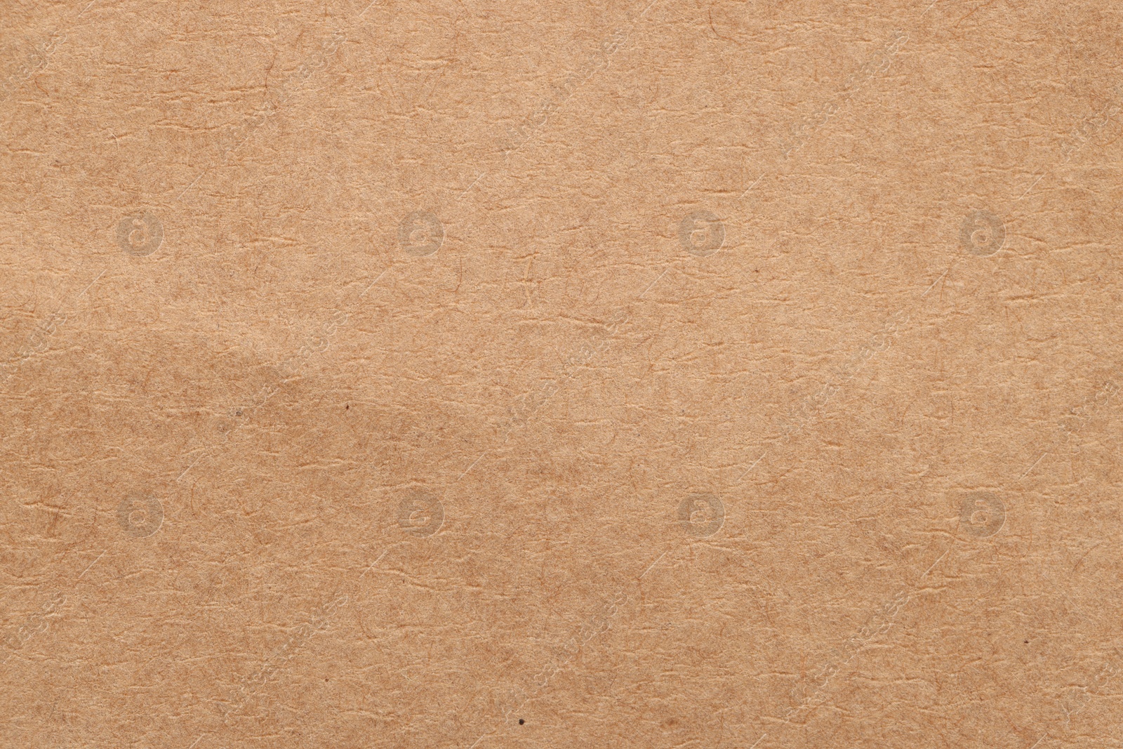 Photo of Texture of beige paper sheet as background, top view