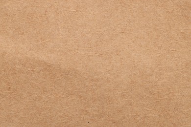 Texture of beige paper sheet as background, top view