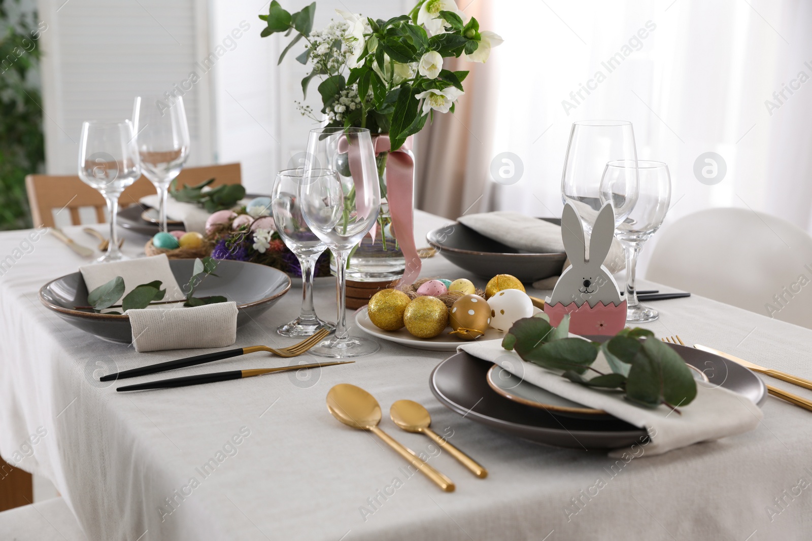 Photo of Beautiful Easter table setting with festive decor indoors