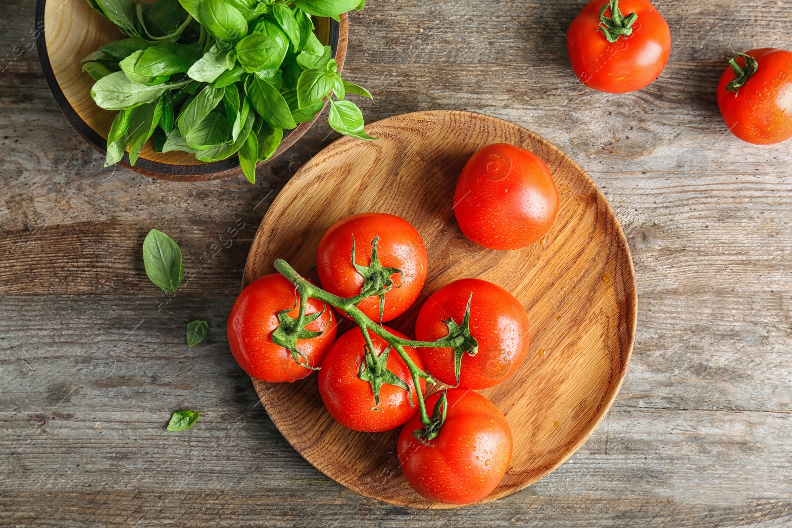 Photo of Flat lay composition with ripe tomatoes and basil on wooden background