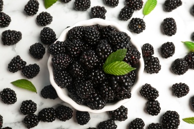 Photo of Flat lay composition with bowl of fresh blackberry on light background