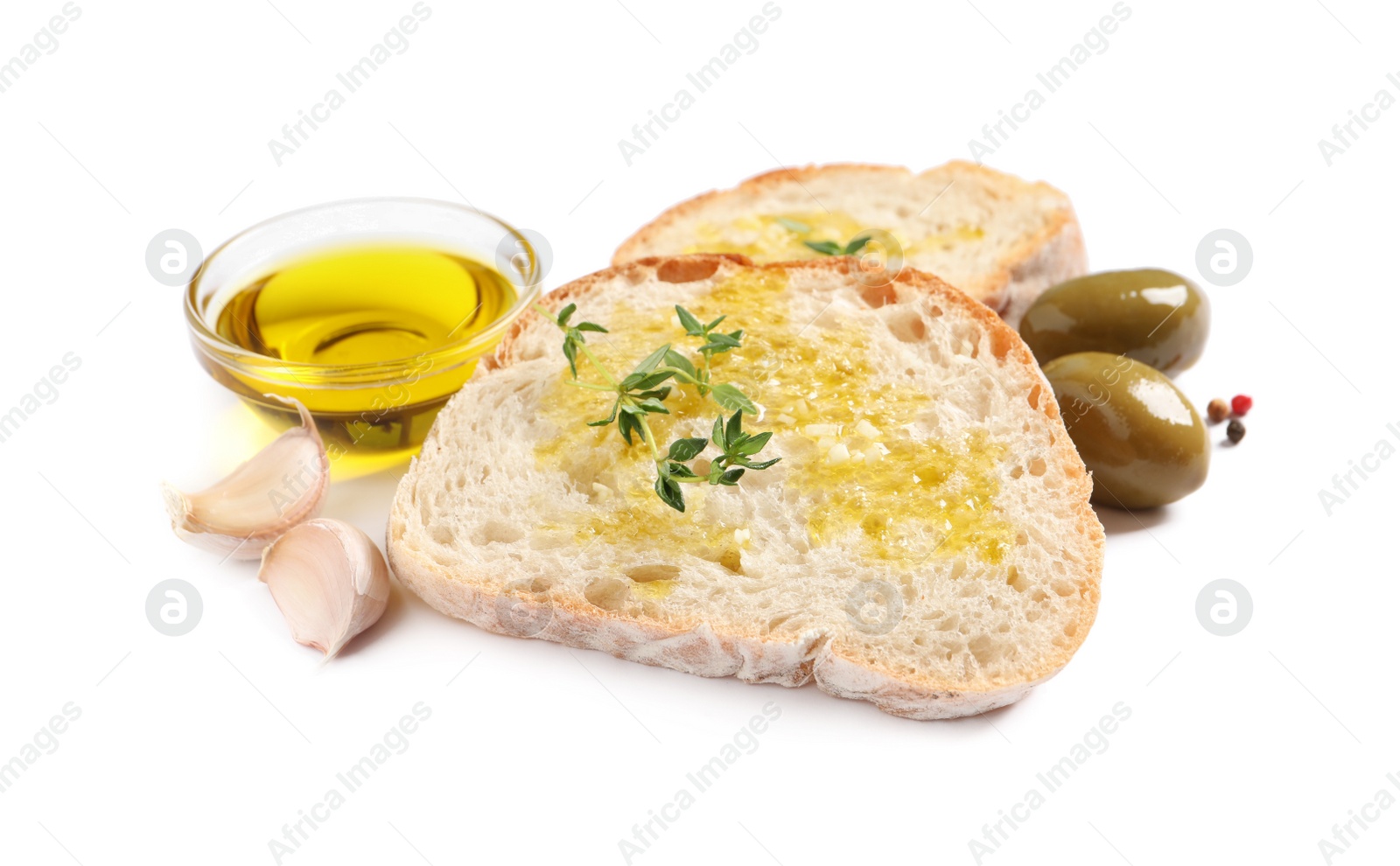 Photo of Tasty bruschettas with oil, garlic and olives on white background