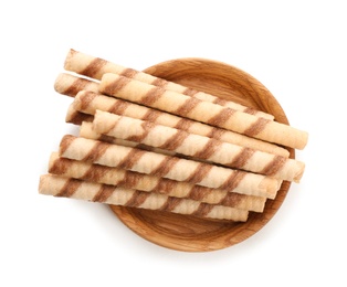 Plate with tasty wafer roll sticks on white background, top view. Crispy food