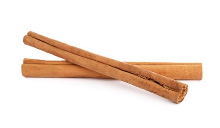 Aromatic dry cinnamon sticks on white background