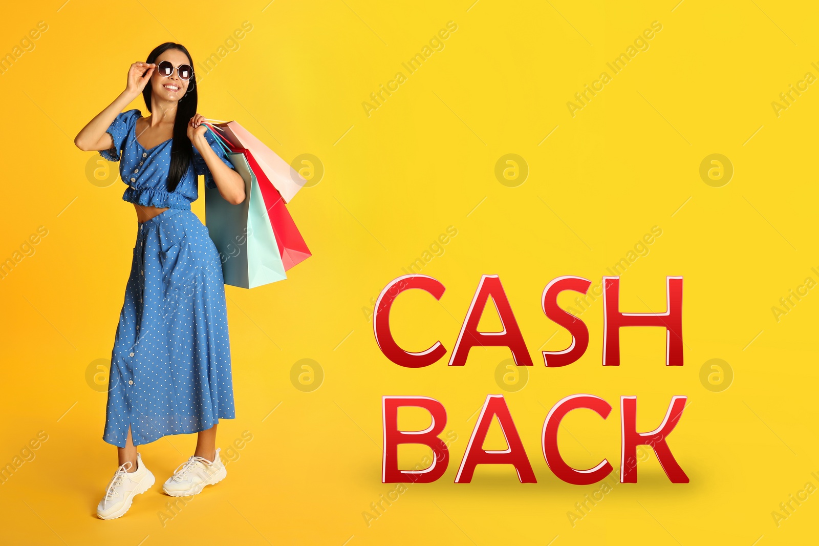 Image of Beautiful woman with shopping bags and words Cash Back on yellow background